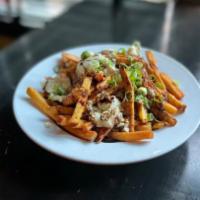 Loaded Fries · A side of crispy french fries topped with port demi, roquefort butter and scallions.