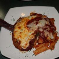 Eggplant Parmesan · Eggplant breaded in a seasoned bread crumb topped with Pomodoro sauce and mozzarella, served...