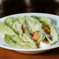 Caesar Salad · Fresh romaine lettuce tossed with vegetarian style homemade caesar dressing served with crou...
