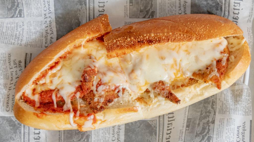 Chicken Parm · Breaded white meat chicken covered with tomato sauce, topped with mozzarella cheese.