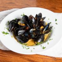 Maxs Famous Mussels · Savory red, spicy red, white wine, garlic or Thai curry.