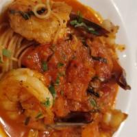 Shrimp Fra Diablo · Red spicy sauce, capellini.