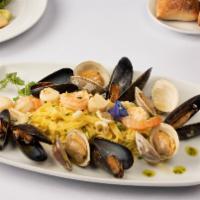 Frutti Di Mare Al Vino Bianco  · Shrimp, calamari, clams, mussels, scallops, garlic, evoo, onion, white wine sauce, tagliatelle
