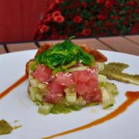 Tuna Tartare · Ahi tuna, avocado, cucumber, seaweed salad, teriyaki glaze, wonton crisps, wasabi