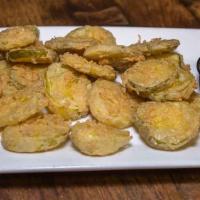 Fried Pickles . · Seasoned, deep fried and served with
parmesan peppercorn dipping sauce.