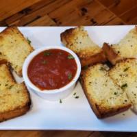 Cheesy Garlic Bread  · Toasted French bread, topped with a three
cheese blend, served with marinara.
