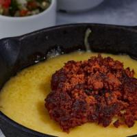 Queso Fundido · Sizzling, melted Chihuahua cheese with your choice of Mexico’s famous chorizo sausage or tra...