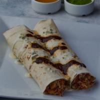 Burrito De La Roqueta · Two soft flour tortillas filled with a choice of chicken or pork, topped with creamy melted ...