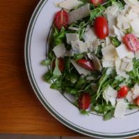 Arugula Salad · Large. Baby arugula, shredded parmigiana cheese, grape tomatoes, and lemon olive oil dressing.