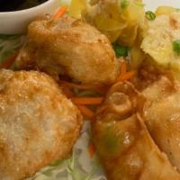 Triple Dumplings · Combination of Thai dumplings, tulip dumplings and veggie dumplings served with sesame soy s...