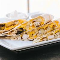Blackened Chicken Quesadilla · cheddar jack, caramelized onions, roasted peppers, corn, flour tortillas, w. sour cream and ...