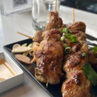 Chicken Gai Yang · 4 skewers of Thai style grilled chicken with rice and salad