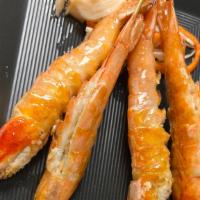 Pazun Kin · Gluten-free. 4 skewers of Grilled shrimp (shell and head) with rice and salad