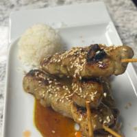 Chicken Teriyaki · 4 skewers of Japanese style chicken served with rice and salad.