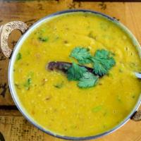 Yellow Dal Tadka · Yellow lentil simmered with cumin, garlic & finished with cilantro butter
