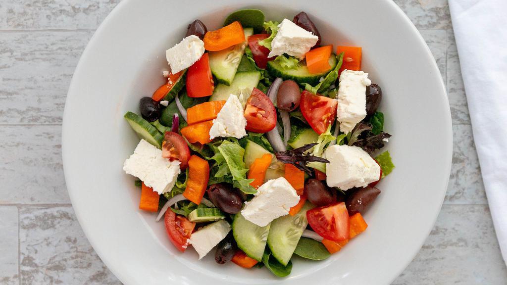 Greek · Greens with cucumbers, tomatoes, peppers, onion, romaine, Kalamata olives and feta cheese with Greek dressing.