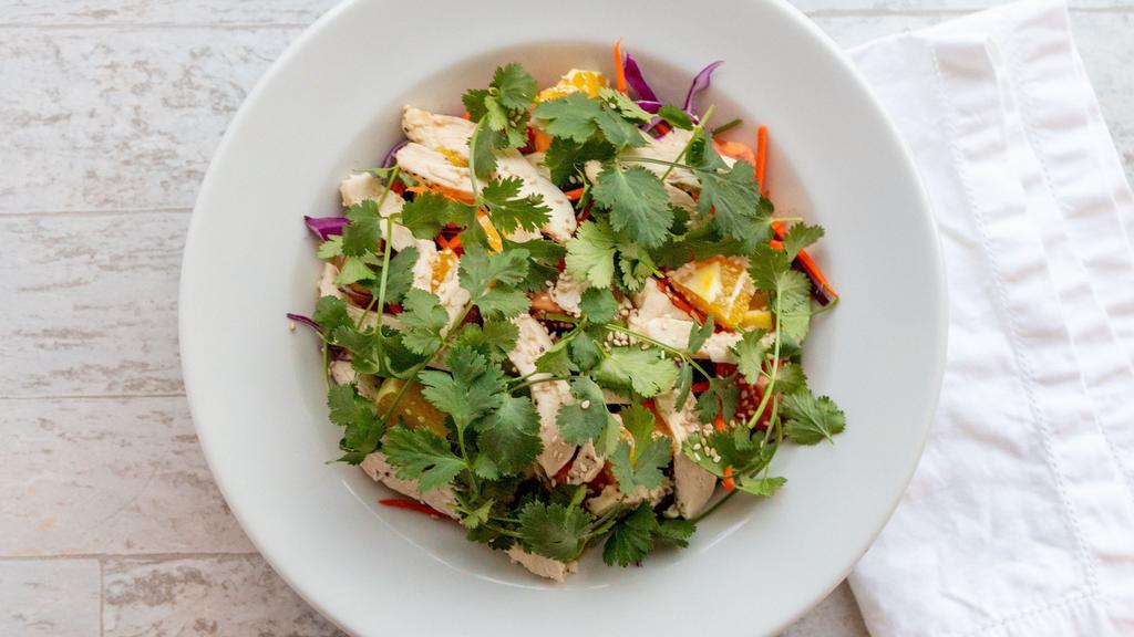 Asian Chicken Salad · Greens with cabbage, chicken, carrots, oranges, cherry tomatoes and cilantro with toasted sesame seeds and ginger vinaigrette.