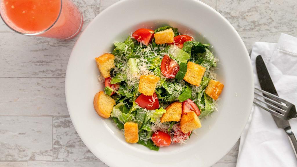 Caesar · Crispy romaine, parmesan and croutons with traditional Caesar dressing.
