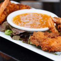 Coconut Crusted Shrimp · Hand breaded with shredded coconut served with our tangy orange Dijon marmalade