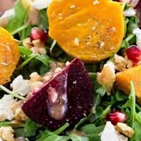 Toasted Goat Cheese And Roasted Beet Salad · Field greens topped with toasted goat cheese, roasted beets, red onions, walnuts, and balsam...