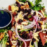 Poached Pear Salad · Red wine poached pears on field greens with craisins, red onions, walnuts, smoked Gouda and ...