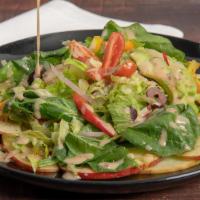 House Salad · Romaine lettuce, bell peppers, red onions crunchy red apples with a savory citrus base veget...