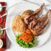 Chowpan · Half rack of lamb marinated, grilled and served on a bed of afghan bread with sauteed eggpla...