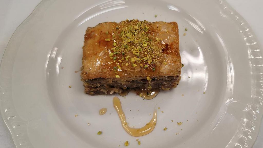 Bucklawa · Layers of homemake thin pastry with walnuts, almonds, pistachios, spiced with cinnamon and cloves, then baked and finished with honey caramel.