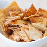 Home-Made Pita Chips · Baked and seasoned with thyme herb blend (with sesame seeds).