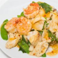 Basil Treasure · Hot and spicy. Chicken, prawn and scallops with garlic, ginger and snow pea pods in a transl...