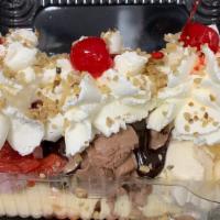 Banana Boat · 3 scoops of ice cream, banana, hot fudge, strawberries, pineapples, fresh whipped cream, wal...