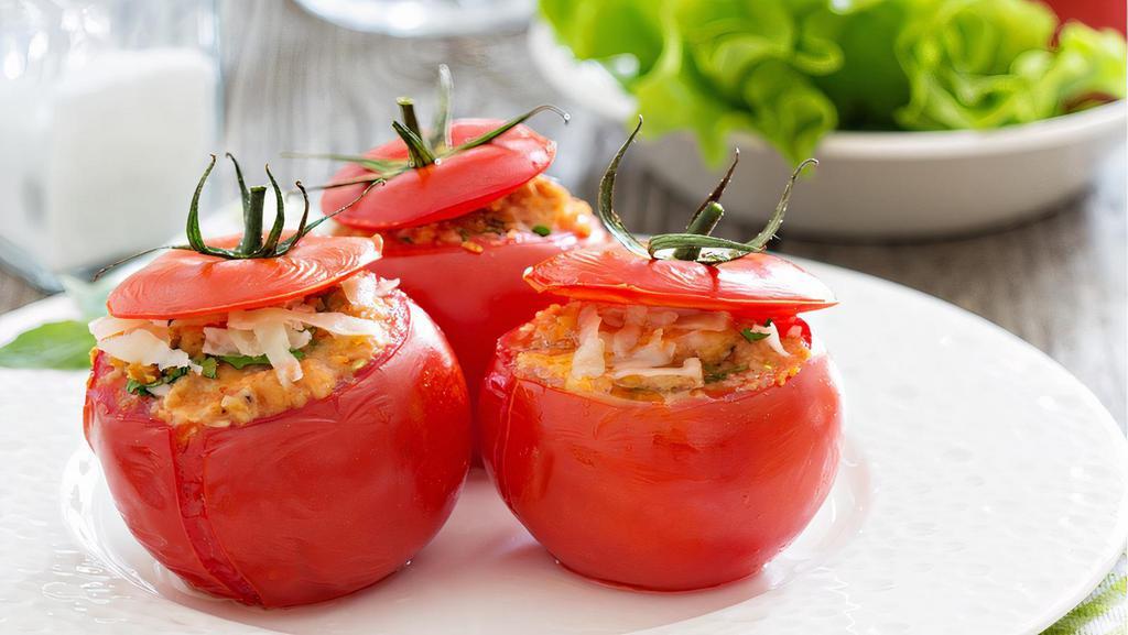 Stuffed Tomato · Served with fresh fruit.