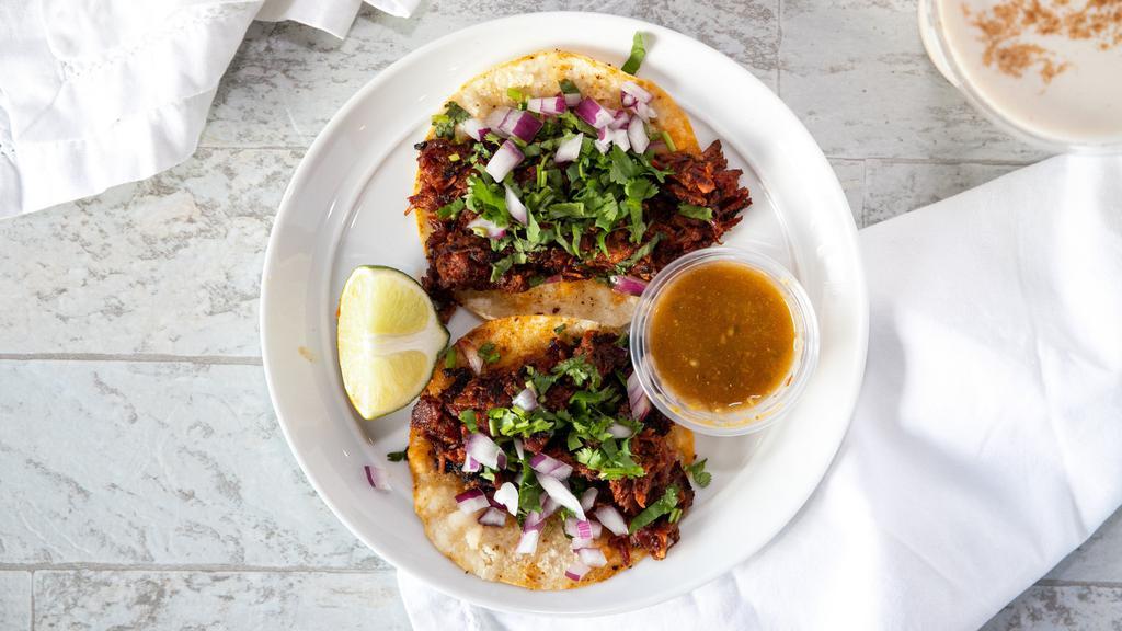 Al Pastor · The tender pork is marinated in a delicious sauce overnight. Then it is slowly grilled, thinly sliced, and served with fresh pineapple, cilantro, and chopped onions. Order of 3 Tacos with Mama's salsa