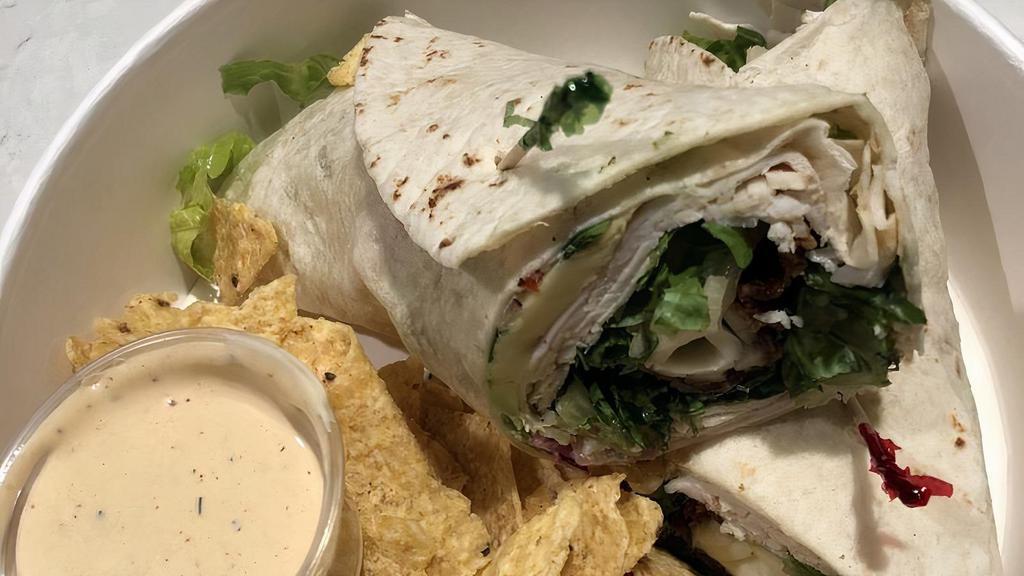 California Turkey Wrap · Fresh sliced turkey, bacon, pico de gallo, cheddar cheese, cream cheese, avocado, fresh organic lettuce with our home made chipotle dressing served on your choice of tortilla wrapd on your choice of tortilla wrap.