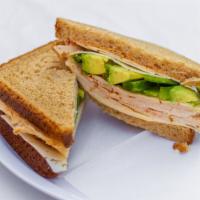 Diablo Sandwich · Buffalo chicken, pepper Jack cheese, chipotle mayo, avocado and green pepper on rustic white...