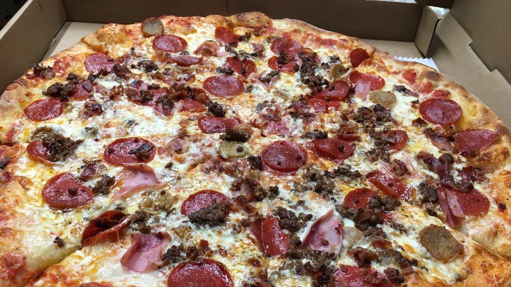 The Meat Lover Pizza · Made with hand sliced pepperoni, spicy Italian sausage, bacon, ham and hamburger.