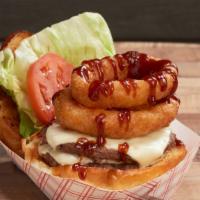 Bbq Burger · 2 Certified Angus Beef patties or IMPOSSIBLE Burger, BBQ Sauce, and 2 Onion Rings on top.