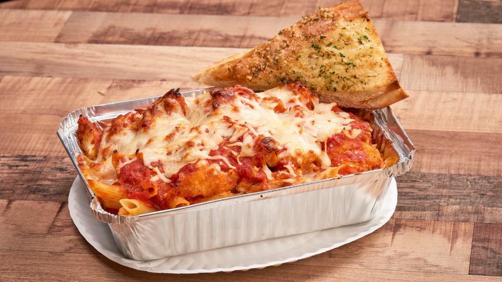 Eggplant Parm · Penne pasta. Served with our premium pasta sauce, breaded eggplant, melted cheese and garlic bread.