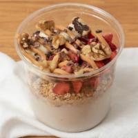Cacao-Nut Bowl · A blend of coconut milk, coconut milk frozen yogurt and banana. Topped with granola (gf), ba...