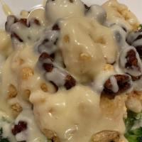 Crispy Shrimp With Honey Walnut · Crispy honeyed shrimp tossed in a creamy, sweet mayonnaise mixture, topped with candied waln...