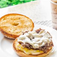 Philly Cheesesteak · Rib eye Steak, Sautéed Sweet Onions, Provolone.