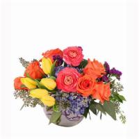 Vivid Splendor Floral Arrangement · This vivid bouquet is sure to be a hit! With lovely yellow tulips, superb coral roses, styli...
