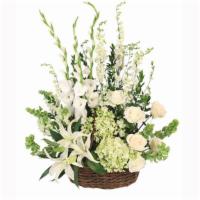 Peaceful Basket Arrangement · Send your deepest condolences to the family and friends With a basket of flowers that truly ...