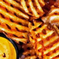 Spicy Waffle Fries · with side of Boom Boom sauce