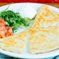 Grilled Quesadilla · Try our delicious quesadilla stuffed with cheese and your choice of meat side with lettuce, ...