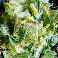 Caesar Bowl  · Romaine lettuce with miso caper dressing, garlic croutons, almond parmesan.