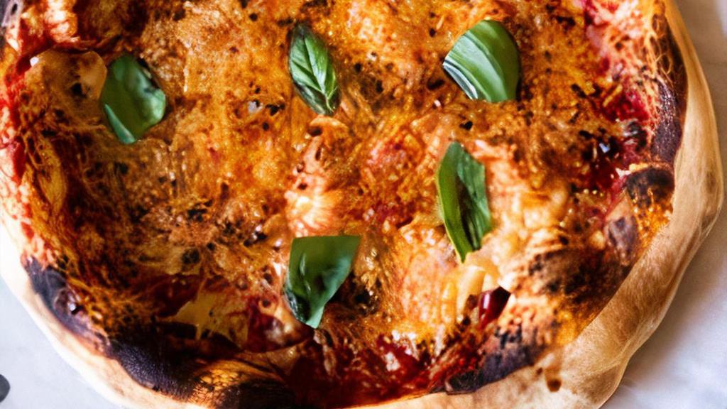 Margherita Pizza · Melted mozzarella, fresh basil, garlic, organic tomato sauce, olive oil. NF