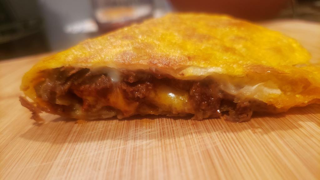Quesadilla · Pan fried flour tortilla filled with cheese and your choice of meat