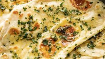 Garlic Naan · Favorite. Bread topped with fresh minced garlic and herbs.