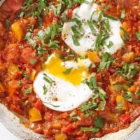Shakshuka · Vegetarian. Crushed fresh tomatoes, onion with our spices, topped with black olive, cilantro...